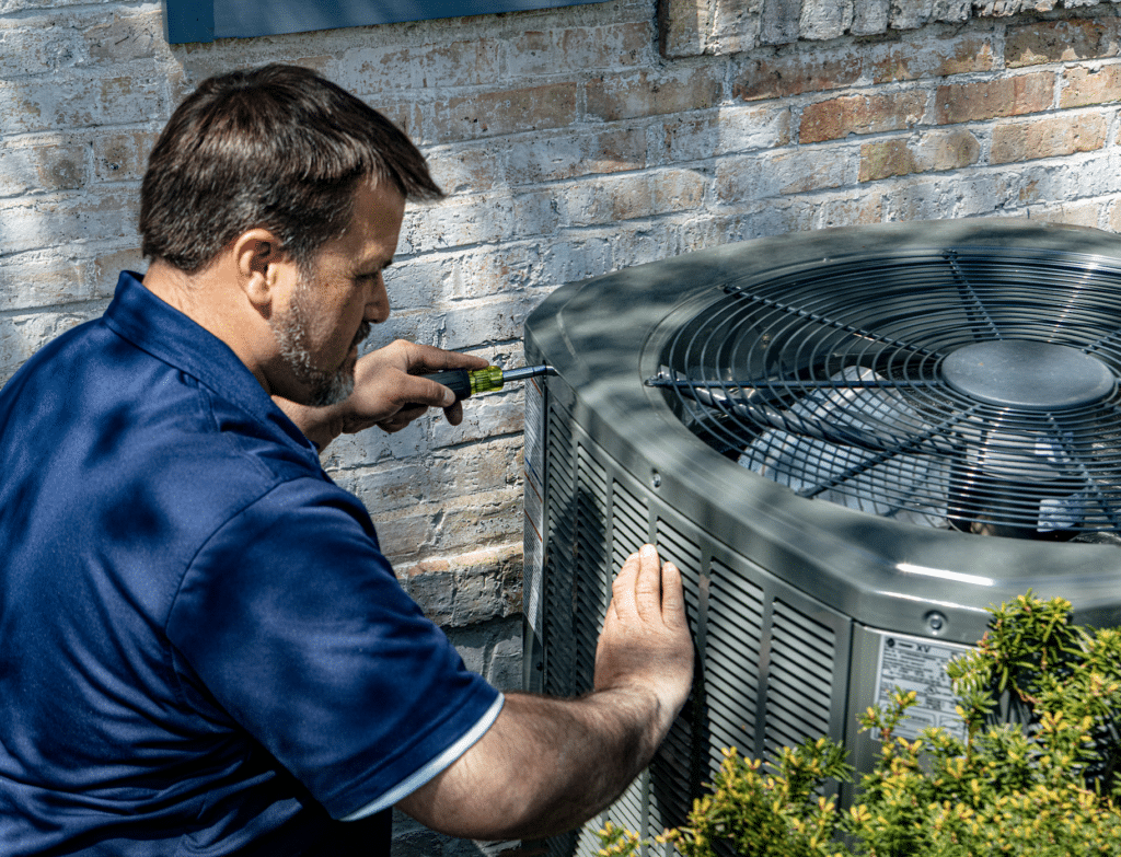 Chicago hvac technician inspecting heat pump